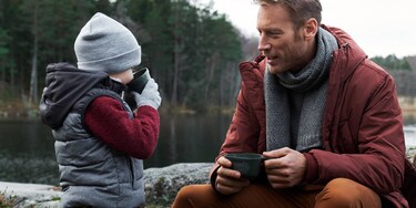 father and son having a picnic